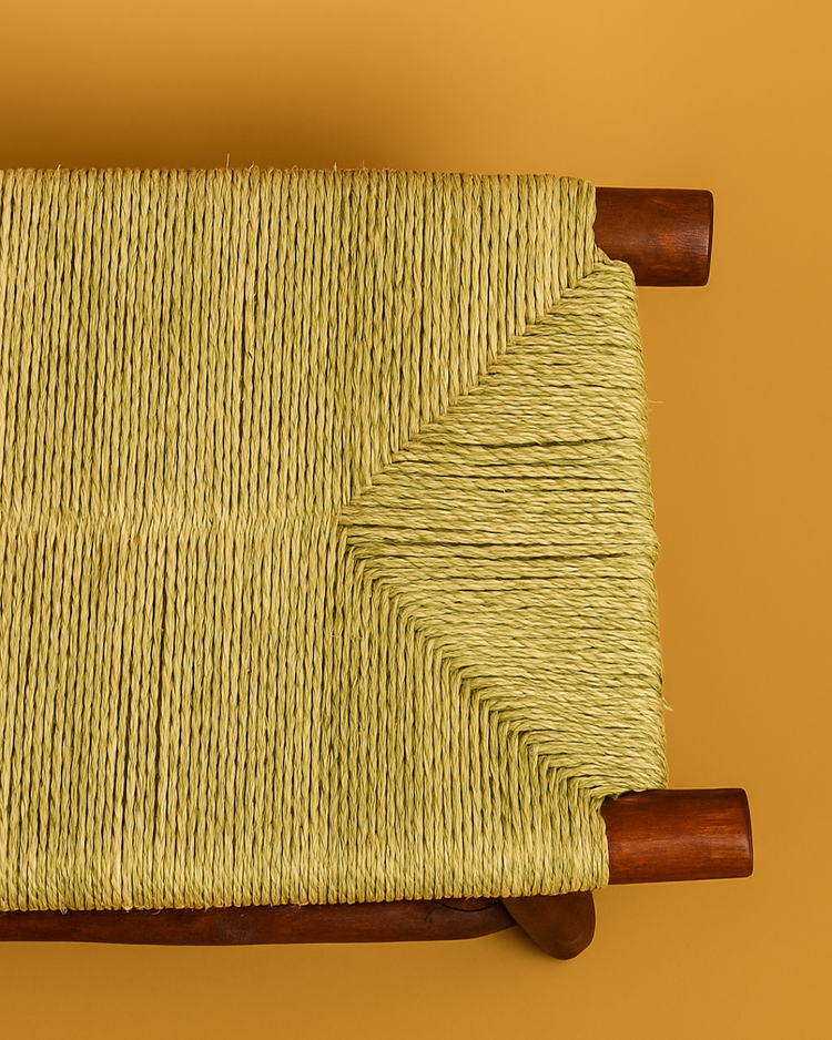Elegant Moroccan bench featuring intricate palm leaf weaving showcasing traditional craftsmanship and design.