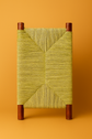 Elegant Moroccan bench featuring intricate palm leaf weaving showcasing traditional craftsmanship and design.