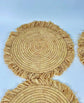 Handmade round raffia placemats with fringed edges - Natural table setting..