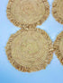 Handmade round raffia placemats with fringed edges - Natural table setting..