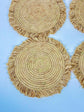 Handmade round raffia placemats with fringed edges - Natural table setting..